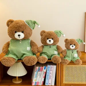 Cute pajama teddy bear plush toy set, soft stuffed doll with green polka dot sleepwear for kids.