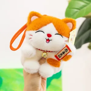 Cute lucky cat plush pendant, soft stuffed fortune cat toy with bell and red scroll for girls.