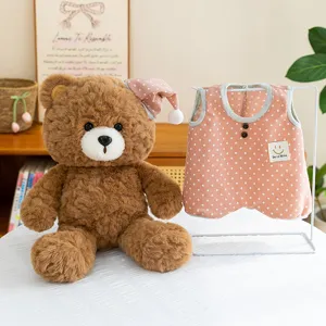 Cute brown teddy bear plush toy with a sleeping hat and matching pink polka dot vest!
