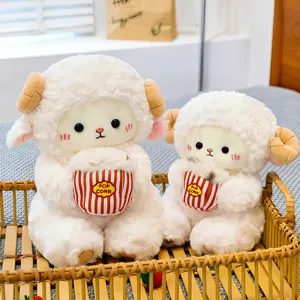 Cute sitting sheep plush toy holding popcorn bucket, soft stuffed animal doll, cozy bedroom decor.
