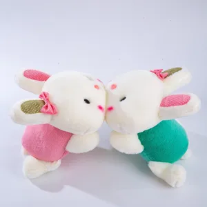 Simpatico paio di coniglietti di peluche sdraiati, morbido cuscino di bambola di coniglio, regalo.
