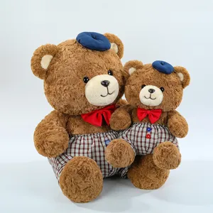 Cute brown plush teddy bear set with blue berets and red bowties for lovely kids toys.