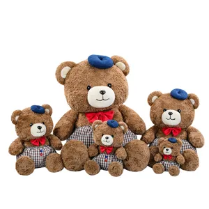 Cute teddy bear plush toy set with blue beret and red bowtie, soft doll decoration.