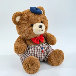 Cute brown teddy bear plush toy with blue beret and red bow tie wearing plaid shorts for kids