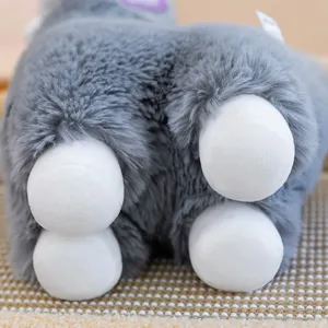 Grey fluffy alpaca plush toy detail view, featuring soft plush fabric and cute white feet.