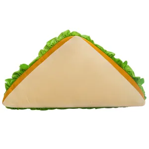 Close-up of cute sandwich plush pillow detail, soft lettuce edge texture, cozy home decor.