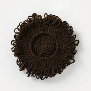 Close-up detail of the brown knitted curly wig hat, featuring unique fluffy yarn texture design.