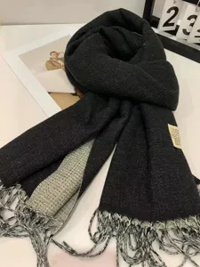 Black grey double-sided cashmere feel winter scarf with fringe and stylish label detail.