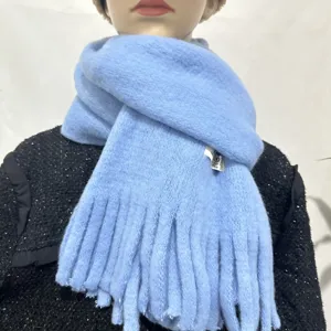 Light blue cashmere-feel tassel scarf detail view, soft warm winter neck wrap accessory.