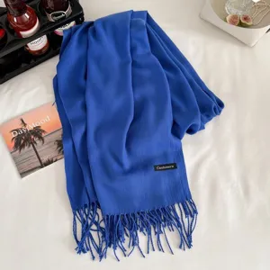 Blue imitation cashmere winter scarf detail view, showing soft fabric texture and elegant fringe.