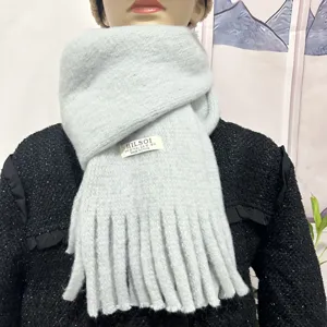 Light blue soft winter scarf for women, cozy knitted neck warmer with fringe detail, cozy chic.