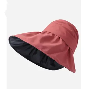 Sombrero de sol de verano anti-UV de ala ancha, exterior rosa y forro negro para exteriores.