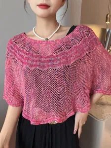 Roze gebreide ajour zomer zonbescherming cape detail, lichtgewicht ademende stranddoek.