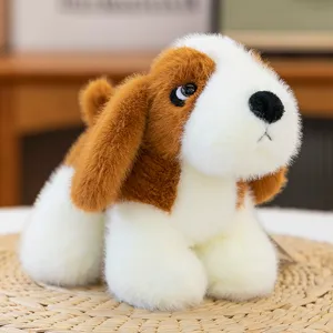 Cute brown and white puppy plush toy close-up, soft stuffed animal doll for kids gift and room decor.