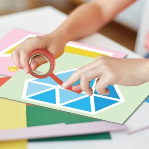 Kids DIY washi tape craft detail showing creative sticker book crafting process and fun design.