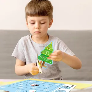 Kids educational Christmas paper cutting book detail, showing safe scissor usage.