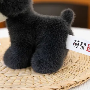 Detailed view of the cute black puppy plush toy, soft stuffed animal doll for kids gift.