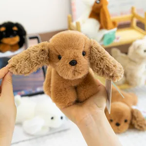 Detail shot of the cute brown puppy plush toy, soft texture, perfect palm-sized cute companion.