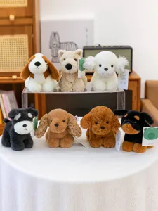 Detailed view of cute plush dog toys collection, soft stuffed animal dolls desktop decor.