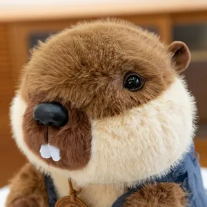 Cute brown marmot plush toy detail with soft fur, blue vest and adorable facial features.