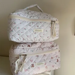 Cute quilted cosmetic bag with bear and cherry patterns, portable large capacity travel makeup pouch.