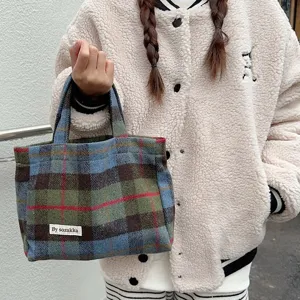 Retro plaid woolen handbag for women, casual tote bag with top handle and stylish design.