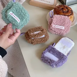 Fluffy mini plush headphone storage bag cute portable AirPods case with convenient neck strap.