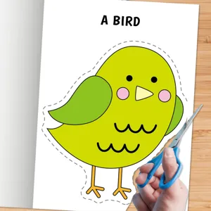 Détail du livre d'activités de découpage pour enfants, design oiseau vert mignon avec des ciseaux.