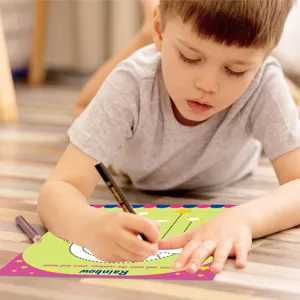 Children's pen control training tracing book detail view, showing kids drawing and learning lines.