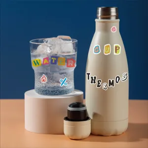 Decorative washi tape letter stickers for DIY craft journaling and custom water bottle design.