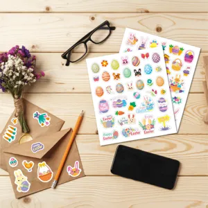Easter sticker set detail featuring cute bunnies and colorful eggs on wooden desk background.