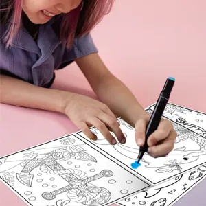 Detailed view of children coloring marine life line art with a black marker in a creative book.