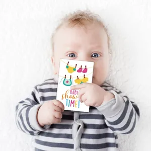 Cute baby shower greeting card with baby clothes design, perfect invitation for newborn parties.