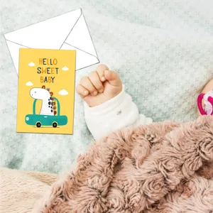 Baby shower greeting card with envelope, cute cartoon giraffe design for newborn parties.