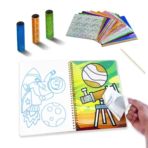 Kids magic foil art craft set detail showing colorful holographic sheets and astronaut notebook.
