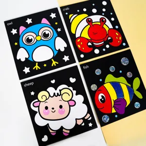 Foil art craft set detail showing colorful transfer stickers on black animal cards for kids.