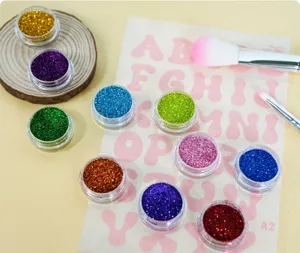 Colorful body glitter set with various jars, makeup brushes and stencil sheet for DIY makeup.