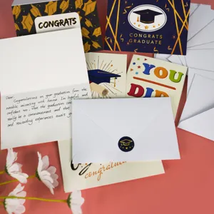 Detailed view of graduation greeting cards set with handwritten English messages and envelopes.