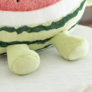 Close-up detail of the cute watermelon plush toy showing soft fabric texture and cute feet.