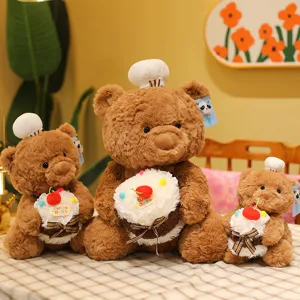 Cute chef teddy bear plush toy holding a sweet cake, soft stuffed doll for birthday gift and kids.