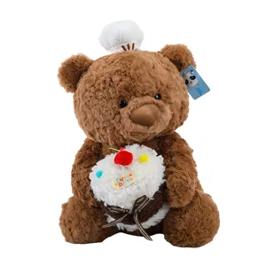 Cute brown plush teddy bear holding a soft cake toy with chef hat, perfect birthday gift.