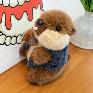 Cute brown marmot plush toy with tattered vest and small tag detail, premium soft material.