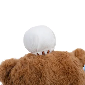 Cute brown teddy bear plush toy detail showing soft fur and white chef hat, perfect birthday gift.