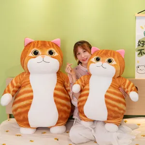 Cozy scene showing details of the large fat cat plush toy in a bedroom setting. Soft material.