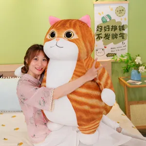Detailed view of a cute fat orange cat plush toy, soft stuffed animal pillow for kids and home.