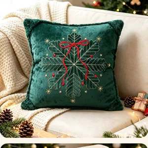 Close-up of the green Christmas throw pillow cover featuring delicate golden embroidery and red bow.