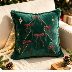 Christmas green velvet pillow cover with embroidered red bows and gold stars for sofa decor.