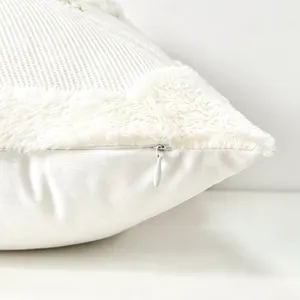White Christmas decorative pillow cover with plush faux fur trim and hidden zipper detail.
