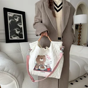 Cream quilted canvas tote bag with cute bear embroidery, pink strap and spacious design.