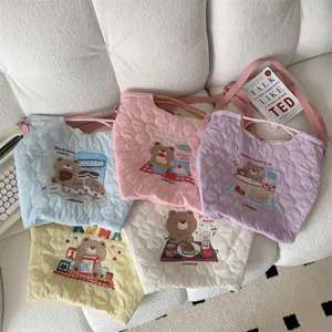 Quilted canvas crossbody shoulder bag set with cute bear embroidery for women daily use.